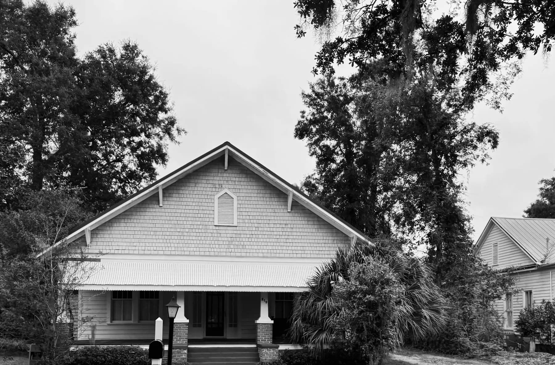 Older home with a wide front porch