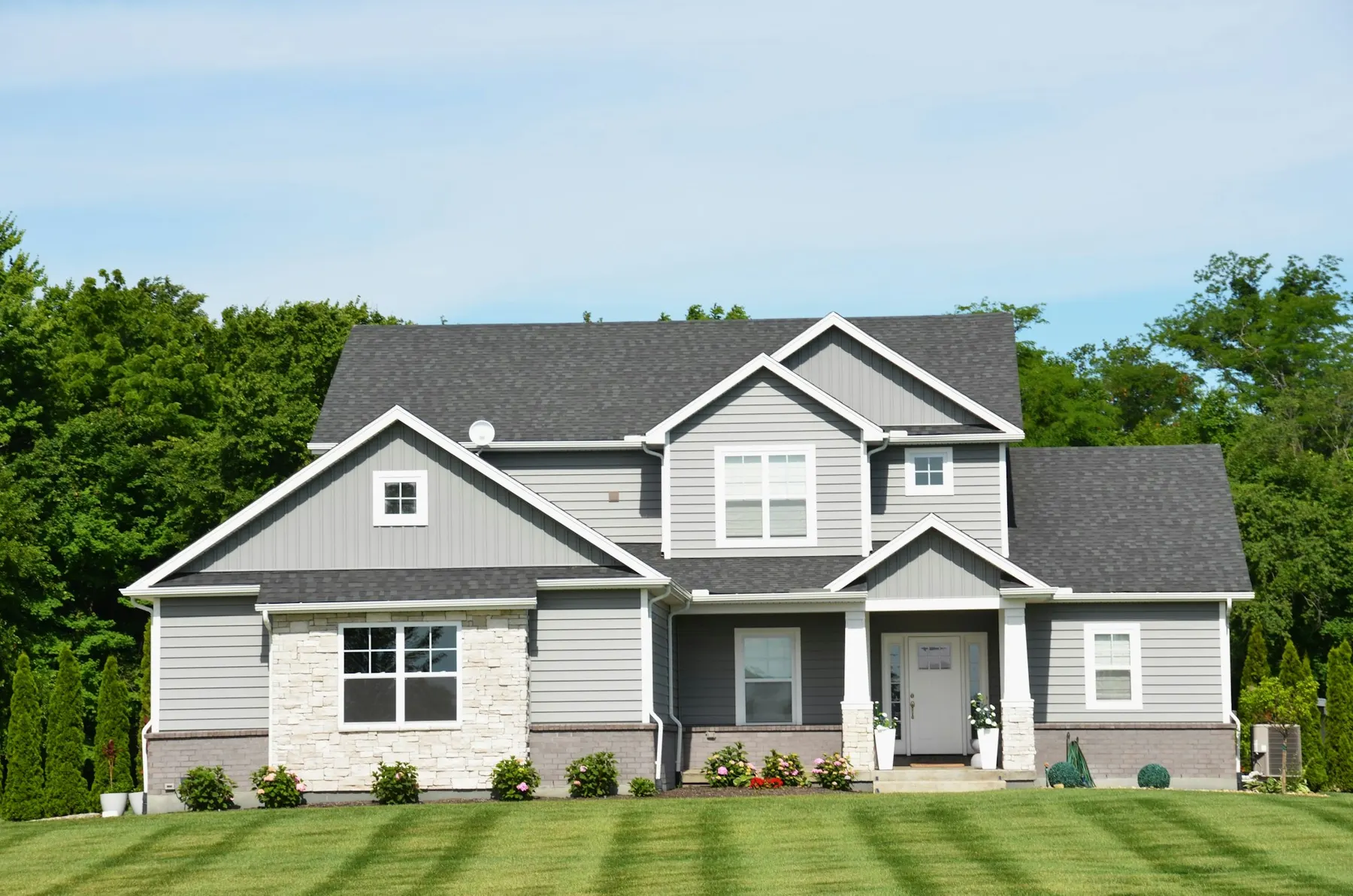 Two-story suburban home with a green lawn